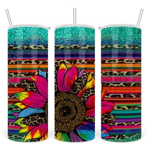 May include: Three stainless steel tumblers with a colourful design. The tumblers feature a vibrant sunflower design with a rainbow of colours, leopard print, and turquoise glitter. Each tumbler has a straw.