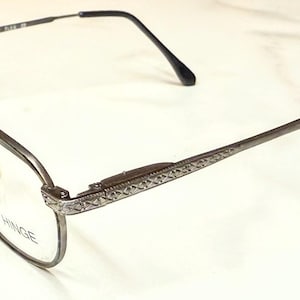 Occhiali da vista Broadway Flex vintage, nuovi, mai usati, con cerniera a molla, montatura color canna di fucile, montatura tartarugata e terminali delle aste neri.