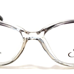 Könnte beinhalten: Transparente, ovale Brille mit schwarzen Rahmen. Die Rahmen haben einen subtilen Farbverlauf von dunkel zu hell. Die Gläser sind klar und die Bügel sind schwarz. Der Text "Star" und "MADE IN CHINA" ist auf der rechten Linse aufgedruckt. Der Text "ST-202 50□16" ist auf der linken Linse aufgedruckt.