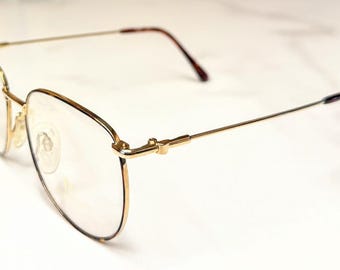 Gafas Rodenstock R0213 nuevas, sin usar, color dorado con montura y puntas de las patillas marrones. Montura descatalogada.