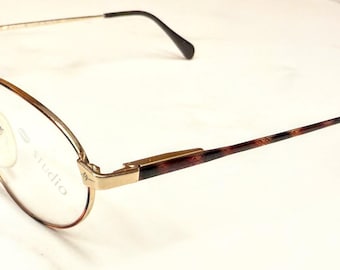 Gafas Vintage Studio (Lips) nuevas de stock antiguo. Puente de filigrana dorado con aro/patas de fusión marrón/negro. Montura italiana descatalogada.