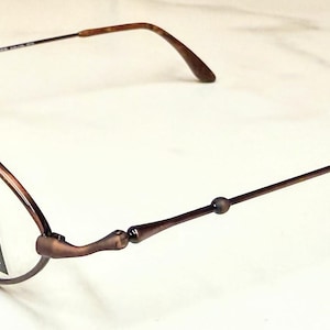 May include: A rustic wooden sign with the text "Welcome to our home" in white lettering. The sign features a distressed finish and a simple, inviting design, perfect for a front porch or entryway.