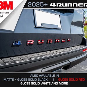 May include: The rear of a black vehicle with the text "4RUNNER" in red and white, with a flag design. The image also includes the text "2025+" and "3M Premium Vinyl". Additional options include matte/gloss solid black, gloss solid red, and gloss solid white.