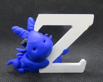 Blue dragon figurine with the letter Z