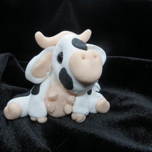 Black and white cow figurine
