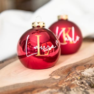 Stylish personalized Christmas bauble in real glass, shiny red