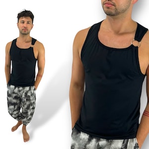 May include: A black sleeveless shirt with a single silver ring on the strap. The shirt has a scoop neck and a relaxed fit.