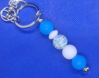 white and blue bead with flower bead