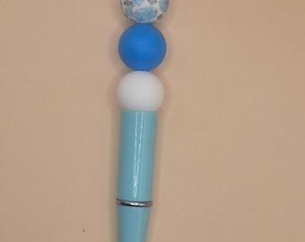 Blue pen with flowers