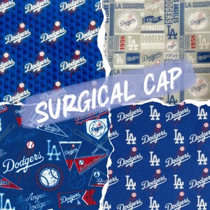 May include: A surgical cap featuring various patterns with the Los Angeles Dodgers logo and text. The designs include the team's logo, baseballs, and the words "Dodgers" and "Los Angeles". The text "SURGICAL CAP" is also visible.
