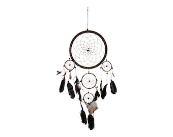 May include: A brown dreamcatcher with black feathers hanging from it. The dreamcatcher has a circular design with a web-like pattern and four smaller circles hanging from it.