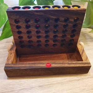 Four in a Row made of wood, travel game
