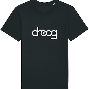 May include: Black crew neck t-shirt with the white word "droog" printed across the chest. The word is in a stylized font. The t-shirt has short sleeves and a classic fit.