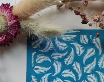 May include: A blue stencil featuring a white fern leaf pattern. The stencil is made from a durable material and is ideal for creating beautiful designs on walls, furniture, and other surfaces.