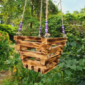 Stunning 6" Orchid Basket with matching purple beads and braded Jute Twine.