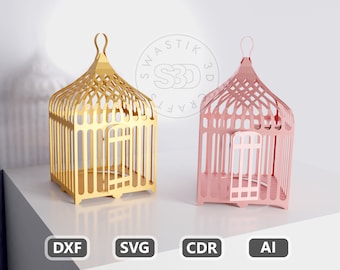 Op de afbeelding: Twee vogelkooivormige dozen, een gouden en een roze, met een decoratief ontwerp. De dozen zijn gemaakt van papier en zijn geschikt voor knutselen en doe-het-zelfprojecten. De dozen zijn gelabeld met de tekst "Swastik 3D Crafts".
