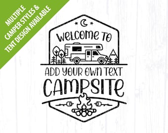 May include: Black and white graphic design of a camper van with mountains and trees in the background. The text "Welcome to" is above the camper and the text "Add your own text Campsite" is below the camper. There is a campfire with marshmallows on sticks below the text.