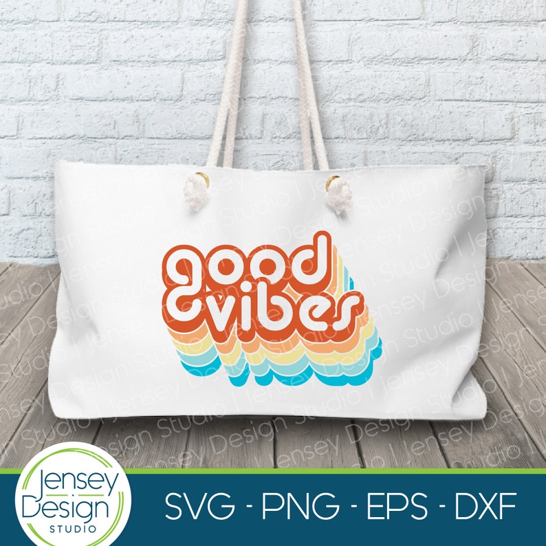 May include: A white tote bag with a colorful retro design that says "good vibes". The design is in shades of orange, yellow, blue, and green.