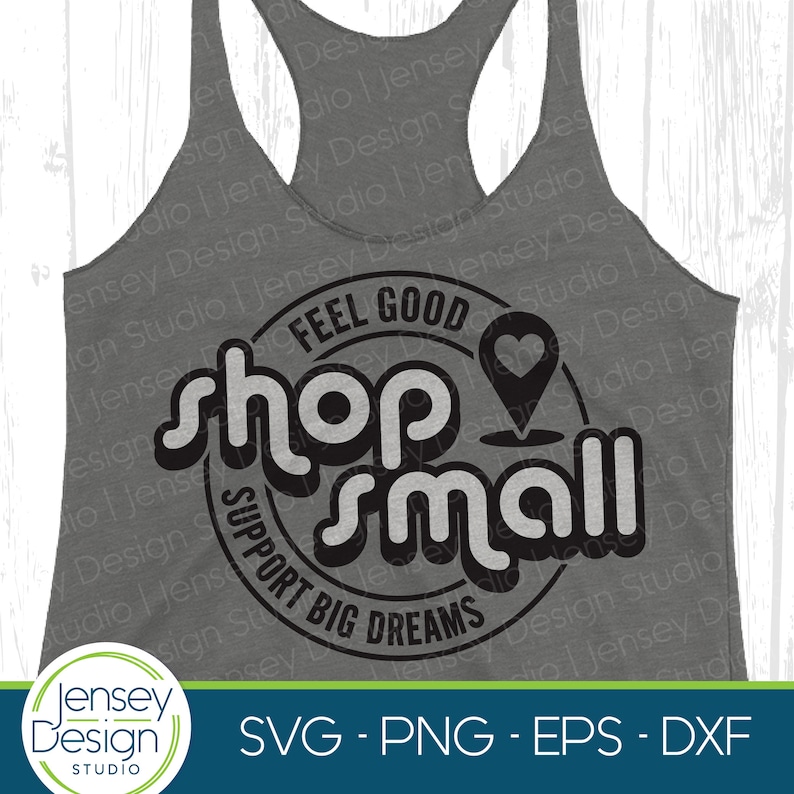 May include: A black and white graphic design on a gray tank top. The design is a circle with the text "Feel Good Shop Small Support Big Dreams" and a heart-shaped pin.