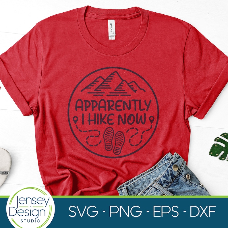 May include: Red t-shirt with a blue circle graphic that says "Apparently I Hike Now" with a mountain and footprint design.