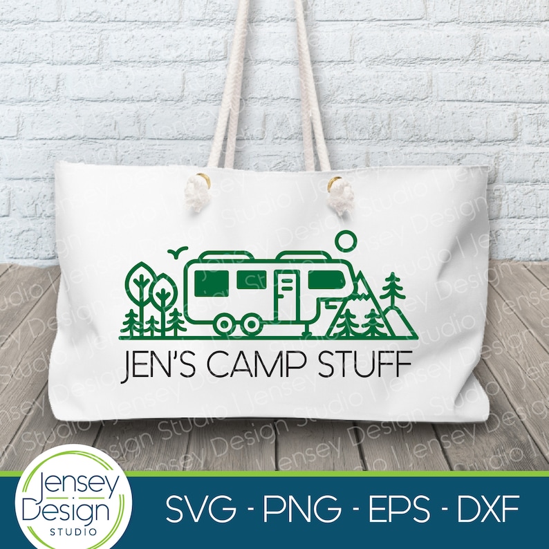 May include: White tote bag with a green line drawing of a camper, mountains, and trees. The text "JEN'S CAMP STUFF" is printed in black below the image.