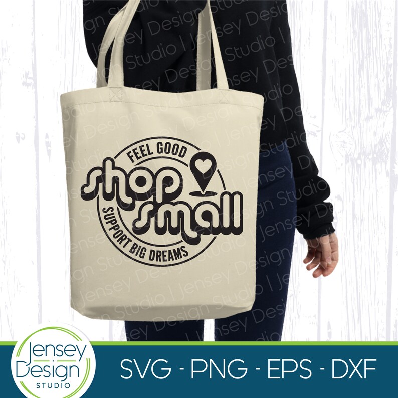 May include: A white tote bag with a black circle design that says "Feel Good Shop Small Support Big Dreams". The design also includes a heart and a pin icon.