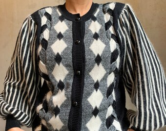 Angora mix soft cardigan with striped puff sleeves. Size M, a bitt oversized. Model size is M. Price 60euro.