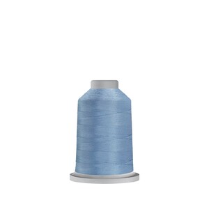 May include: A spool of light blue thread.