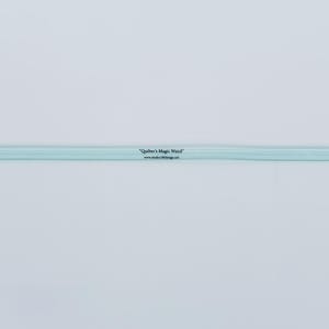 May include: A long, thin, light blue plastic quilting ruler with a straight edge. The text "Quilter's Magic Wand" and "www.studio180design.net" are printed in black along the centre of the tool, with the word "STITCH" printed on the far left end.