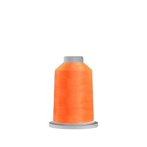May include: A spool of bright orange thread.