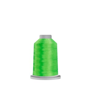 May include: A spool of bright green thread for sewing or embroidery.