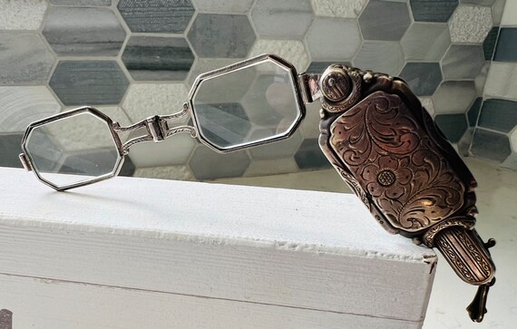 Lorgnette a pair of spectacles with a handle. - image 7