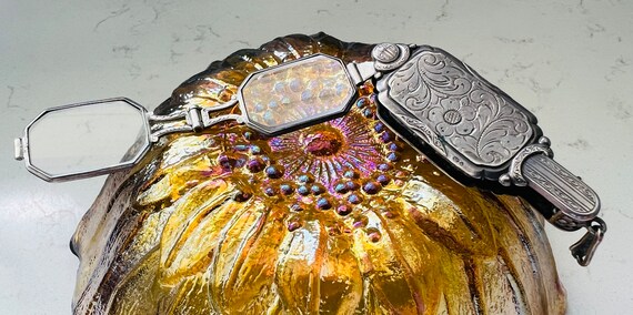 Lorgnette a pair of spectacles with a handle. - image 10