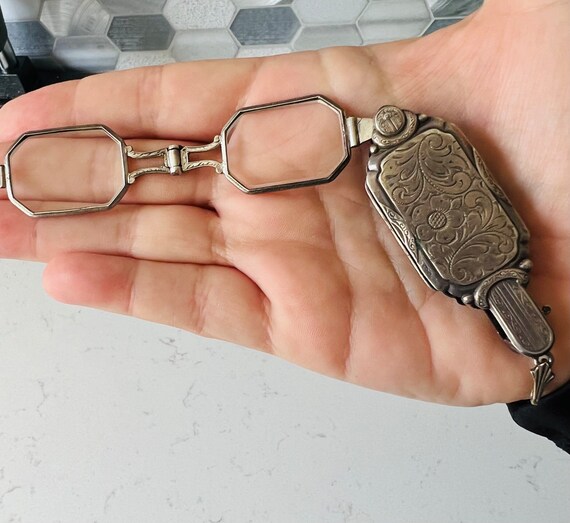 Lorgnette a pair of spectacles with a handle. - image 3