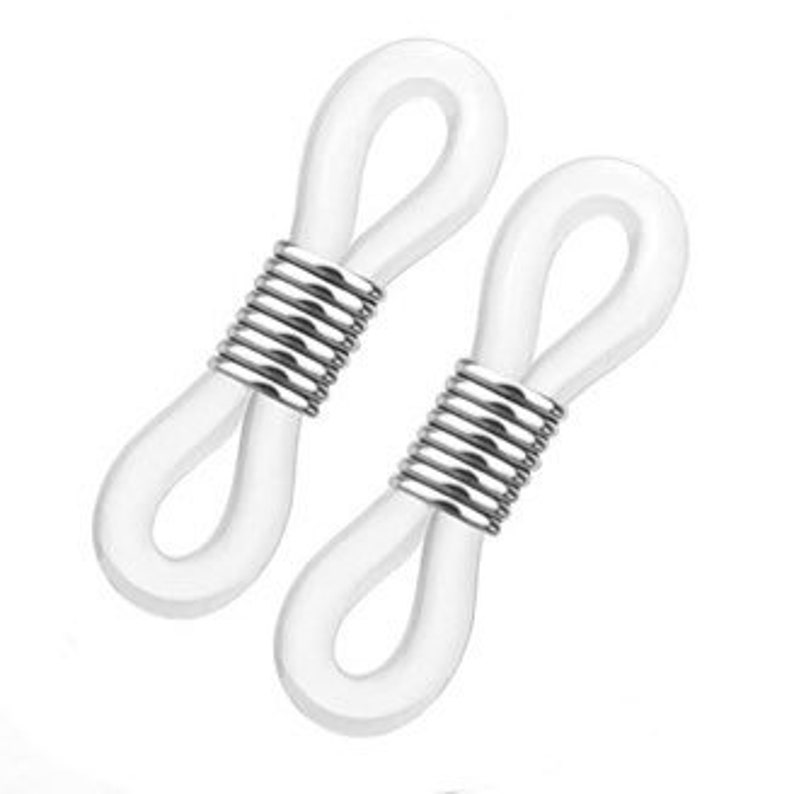 May include: Two white silicone eyeglass strap holders with silver metal coil accents.