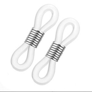 May include: Two white silicone eyeglass cord holders with silver metal accents. The holders are designed to attach to the arms of eyeglasses and prevent them from falling off.