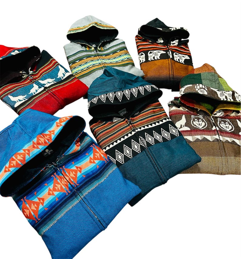 May include: Six hooded sweatshirts with different colorful patterns and designs. The sweatshirts have a zipper closure and a hood. The patterns include geometric shapes, animal prints, and tribal designs.