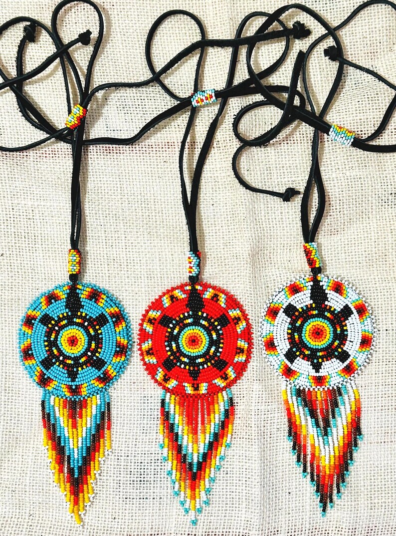From Left to Right. Turquoise Turtle, Red Turtle, White Turtle.