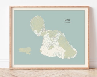 May include: A framed map of Maui, California, with a light blue background and green and white topographical lines. The title "Maui, California" is printed in black text at the top of the map.