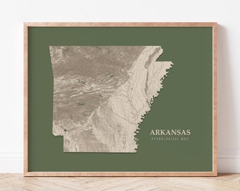 May include: A framed print of a topographic map of Arkansas with a green background. The title "Arkansas Topographical Map" is printed below the map.