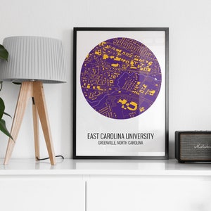 May include: A framed print of a purple and gold map of East Carolina University in Greenville, North Carolina. The map is in a circle and the university's name is printed below the map.
