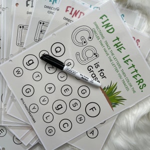 May include: A printable worksheet for kids to practice letter recognition. The worksheet features a large letter G with a dotted line for tracing, and a grid of circles containing various letters, including G. The text "Find the Letters" and "G is for Grass" are also included.