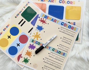May include: Three printable worksheets for learning about primary and secondary colors. The worksheets feature colorful circles, paint splatters, and lines for writing the names of the colors. The worksheets are titled "Primary Colors", "Secondary Colors", and "Primary Colors".