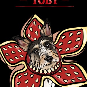 May include: A white and brown dog with a black nose is wearing a red and yellow costume with a flower shape and the text "TOBY" above the dog.