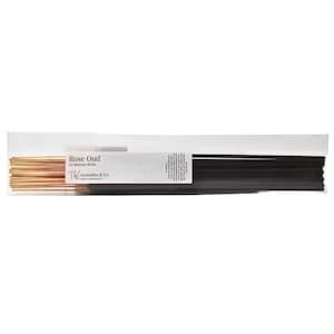 May include: A package of Rose Oud incense sticks. The package contains two bundles of incense sticks, one bundle is gold and the other is black. The package has a white label with the text "Rose Oud 20 Incense Sticks" and the brand name "TW Aromatics & Co."