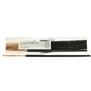 May include: A package of incense sticks labeled "Lavender & Driftwood" with the text "20 Incense Sticks". The incense sticks are dark brown and light brown. The package also includes the text "TW Aromatics & Co."