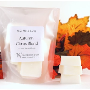 Autumn Citrus Blend Wax Melts: Six (6) Square wax melts in a frosted zip pouch. Each brick is about 1 inch in width, half inch in height and about 1 oz in weight. A label with scent name on the front and warning label on the back.