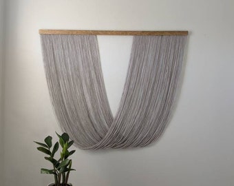 Wooden and Gray Yarn Draped Wall Hanging