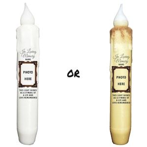 May include: Two white and yellow memorial candles with a photo frame and the text "In Loving Memory NAME" and "This light shines as a symbol of a life and love remembered".