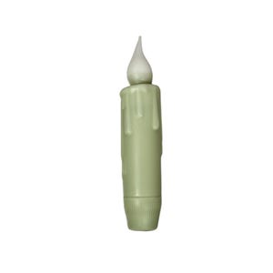 May include: A light green battery-operated candle with a realistic flickering flame. The candle has a dripped wax design and a textured base. The flame is white and shaped like a teardrop. The candle is designed to look like a traditional candle.